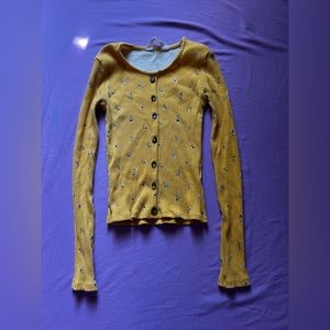 Yellow with flowers shirt , tight fit and only worn a couple times !